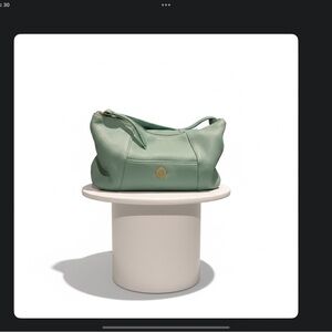 ISAAC MIZRAHII GENUINE LEATHER HAND BAG. LARGE SIDE POCKETS